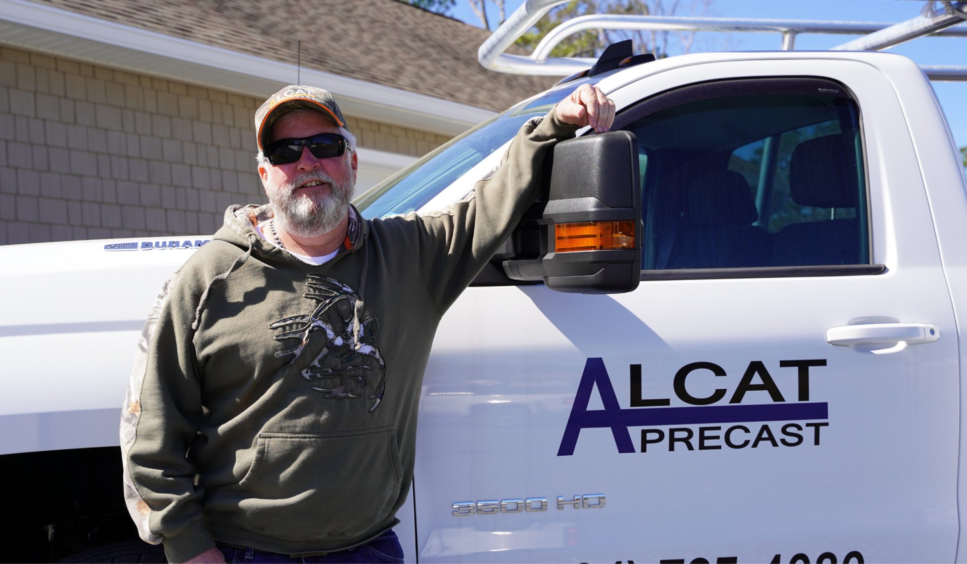 allen standing beside an alcat precast truck