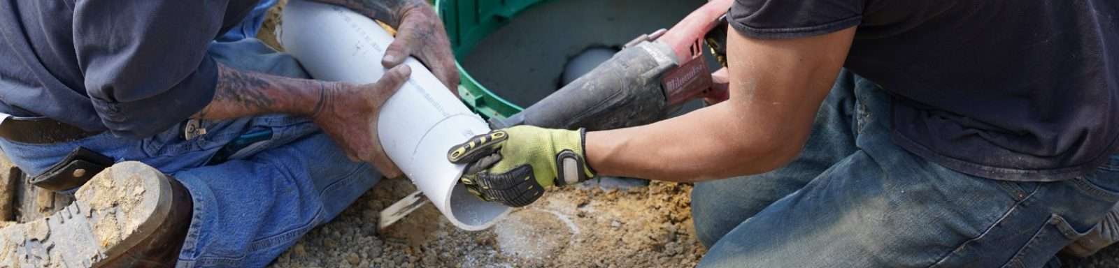 employees working on septic tank install