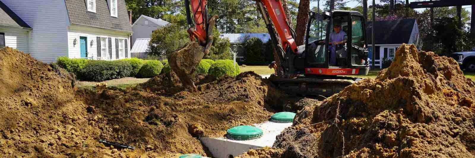 employee operating tractor at installation site