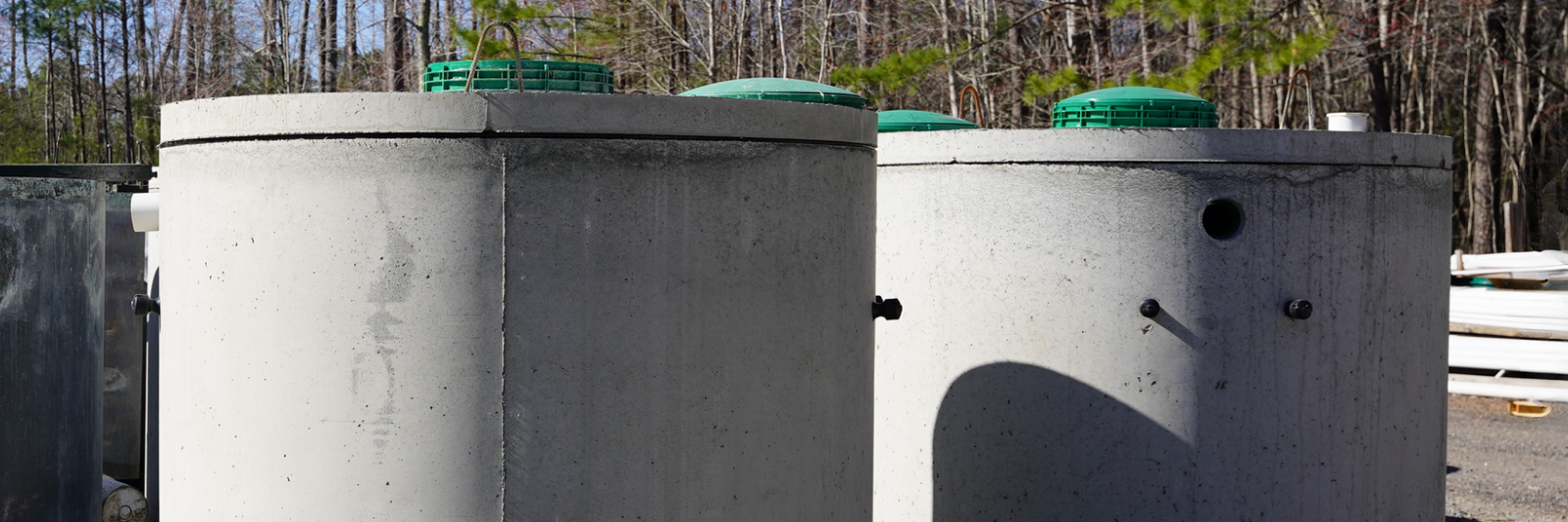 two concrete septic tanks in a row